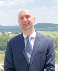 Dr. Samuel Teague smiling outdoors